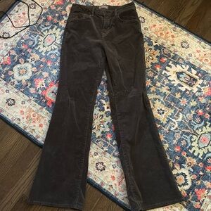 Dark grey, flared corduroy jeans.
